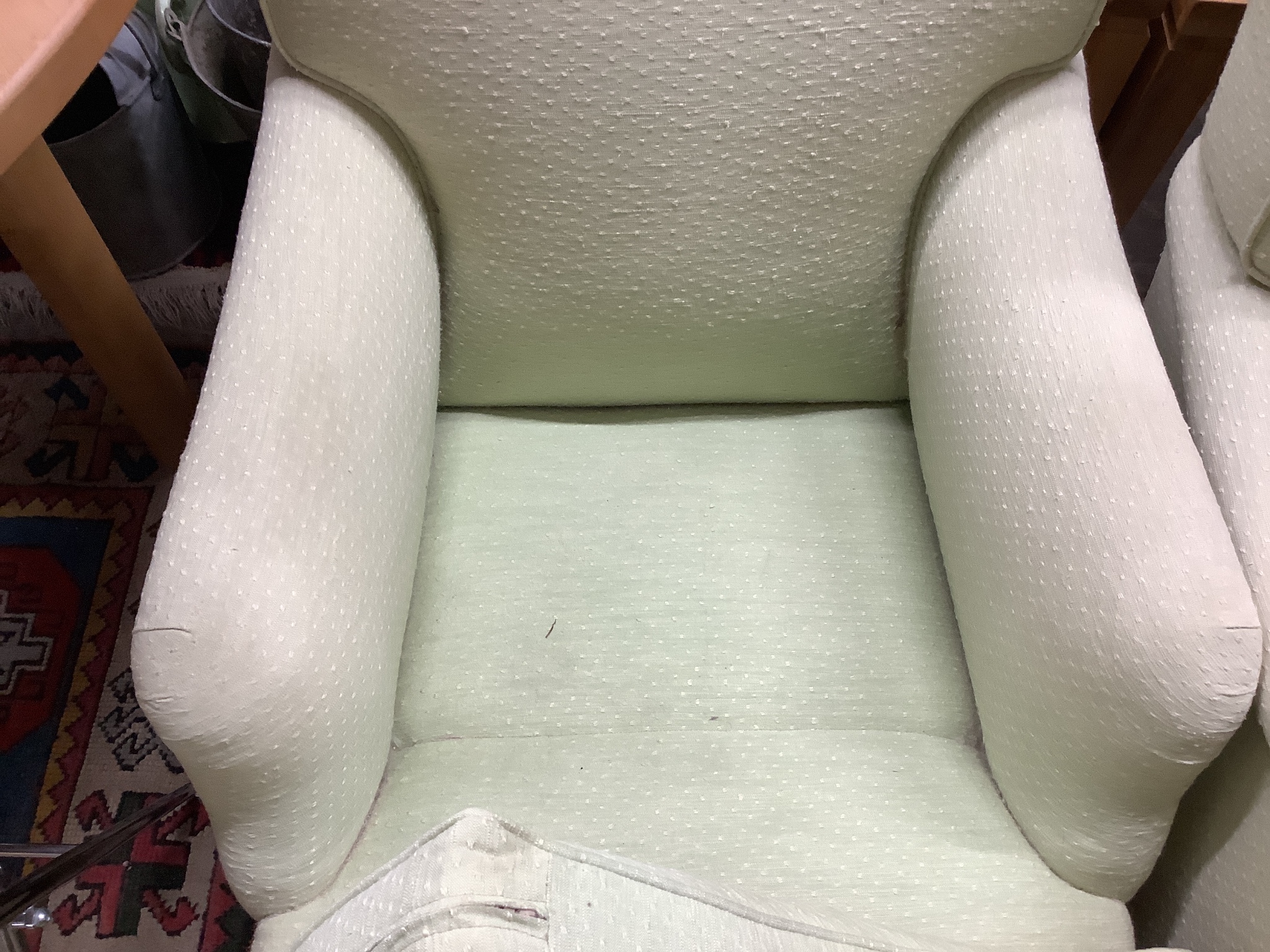 A pair of Howard style armchairs upholstered in lime green fabric. W-70, D-94, H-80cm.